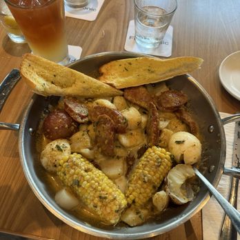 Fin & Tonic - Scallops in garlic and ole bay - Sports Bars Near Me - Sarasota, Florida Fin & Tonic - Scallops in garlic and ole bay - Sports Bars Near Me - Sarasota, Florida