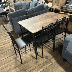 Savvy Surplus - Dining room table set in four chairs