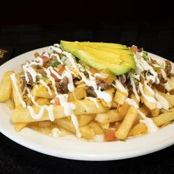 The House of Burger - Our Carne Asada Fries are loaded with juicy steak, melted cheese, beans, pico de gallo, creamy drizzle, and fresh avocado.