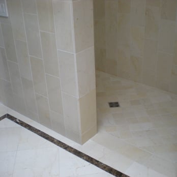 B-Line Tile & Stone - Marble pony wall and shower floor detail with Emperador dark marble inlay and schlueter drain system - Flooring Near Me - Napa, California