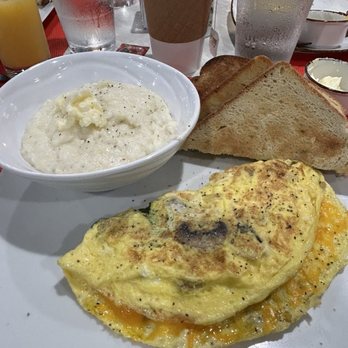 Two Chefs Market & Bistro - Spinach, onion, mushroom and cheddar omelette with amazing grits and homemade country white toast. - Specialty Food Near Me - Sarasota, Florida Two Chefs Market & Bistro - Spinach, onion, mushroom and cheddar omelette with amazing grits and homemade country white toast. - Specialty Food Near Me - Sarasota, Florida