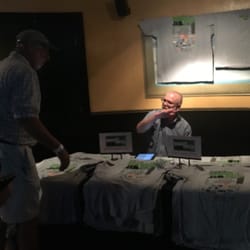 Down The Hatch - Fly Fishing Film Festival - Fly fishing shirts being sold out in the front lobby.