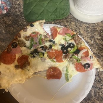 Domino's Pizza - a slice of pizza on a paper plate - Chicken Wings Near Me - Odenville, Alabama Domino's Pizza - a slice of pizza on a paper plate - Chicken Wings Near Me - Odenville, Alabama