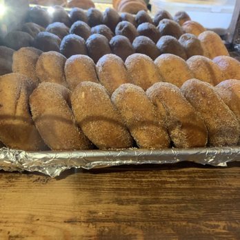 Tyrone Mills - a tray of doughnuts on a table - Desserts Near Me - Bowmanville, Ontario