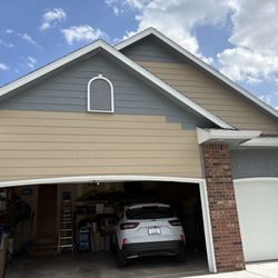 Dependable Painting & More - Front elevation with new siding prior to painting
