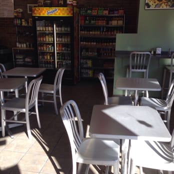 Melas Cafe - tables and chairs in a restaurant - Cafes Near Me - Bronx, New York