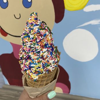 Blizzard Island - a hand holding an ice cream cone with sprinkles - Ice Cream & Frozen Yogurt Near Me - Middlesex, New Jersey