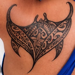 First Tattoo: Manta Ray with 2 Sharks at the bottom and a turtle in the middle. First Tattoo: Manta Ray with 2 Sharks at the bottom and a turtle in the middle.