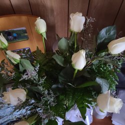 Erika's Flowers - A dozen of white roses with baby's breath in a hand bouquet.