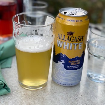 The Crooked Pine - a glass of beer and a can - Cocktail Bars Near Me - Ogunquit, Maine