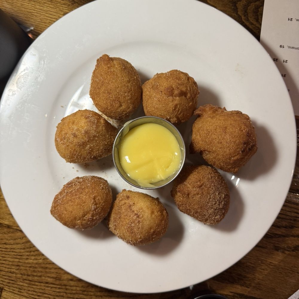 Maverick Biscuit - Doughnut biscuits with lemon curd dipping sauce - Breakfast & Brunch Near Me - Greenville, South Carolina Maverick Biscuit - Doughnut biscuits with lemon curd dipping sauce - Breakfast & Brunch Near Me - Greenville, South Carolina