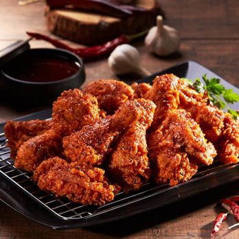 CM Chicken - a plate of fried chicken on a wooden table - Korean Near Me - Farragut, Tennessee CM Chicken - a plate of fried chicken on a wooden table - Korean Near Me - Farragut, Tennessee