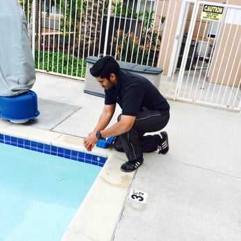 Blue Sky Pool Service - One of our Employees balancing out the chemicals - Pool Cleaners Near Me Blue Sky Pool Service - One of our Employees balancing out the chemicals - Pool Cleaners Near Me