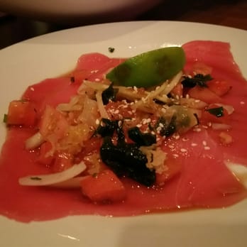 Vanessa's Bistro - Ahi tuna carpaccio with onions, cilantro, tomatoes & ginger soy ($7 happy hour) - Vietnamese Near Me - Walnut Creek, California Vanessa's Bistro - Ahi tuna carpaccio with onions, cilantro, tomatoes & ginger soy ($7 happy hour) - Vietnamese Near Me - Walnut Creek, California
