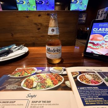 Miller's Ale House - Modelo and football - American Near Me - Winter Park, Florida Miller's Ale House - Modelo and football - American Near Me - Winter Park, Florida