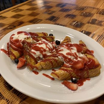 Oldwest Cafe - Graham cracker crusted French toast with strawberry purée, strawberries and blueberries with whipped cream and powdered sugar. - Breakfast & Brunch Near Me - Bedford, Texas Oldwest Cafe - Graham cracker crusted French toast with strawberry purée, strawberries and blueberries with whipped cream and powdered sugar. - Breakfast & Brunch Near Me - Bedford, Texas
