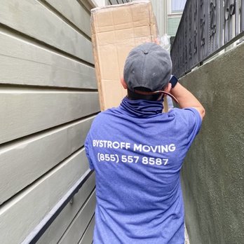 Bystroff Moving - Carefully moving the tandem bike out of the basement through the alley in San Francisco. - Movers Near Me - San Francisco, California Bystroff Moving - Carefully moving the tandem bike out of the basement through the alley in San Francisco. - Movers Near Me - San Francisco, California