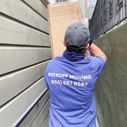 Bystroff Moving - Carefully moving the tandem bike out of the basement through the alley in San Francisco.