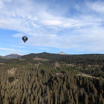 Endeavor Ballooning - Sailing over Big Sky, view of Endeavor's other balloon from our basket - Hot Air Balloons Near Me Endeavor Ballooning - Sailing over Big Sky, view of Endeavor's other balloon from our basket - Hot Air Balloons Near Me