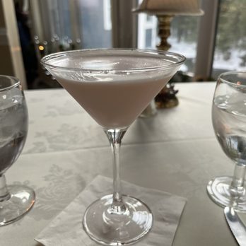Mistral's - a martini in a glass on a table - French Near Me - Manchester Center, Vermont Mistral's - a martini in a glass on a table - French Near Me - Manchester Center, Vermont