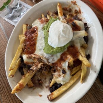 Sol Food - Papi Chulo Papas Fritas: Fries, spicy picadillo, black beans, cheese, guacamole, sour cream, spicy red sauce - Puerto Rican Near Me - San Rafael, California Sol Food - Papi Chulo Papas Fritas: Fries, spicy picadillo, black beans, cheese, guacamole, sour cream, spicy red sauce - Puerto Rican Near Me - San Rafael, California