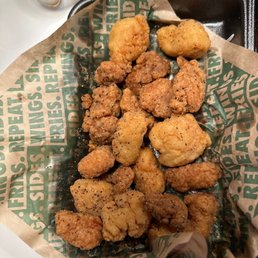 a basket of fried chicken wings a basket of fried chicken wings
