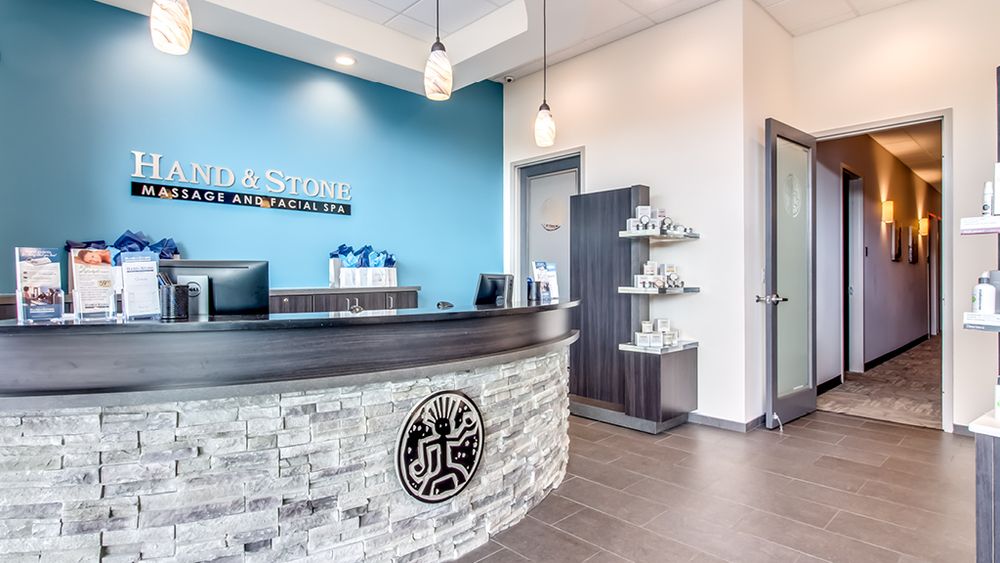 Hand & Stone Massage and Facial Spa Logo