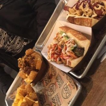 Dog Haus - Sandy - Left to right: Cheese Tots, Chili Cheese Tots, The Hot Chick and The Cowboy - New American Near Me - Sandy, Utah