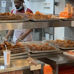 Popeyes - Watched this guy with no gloves or hands touch chicken.  This is also the guy that was sweeping and touching food without washing.