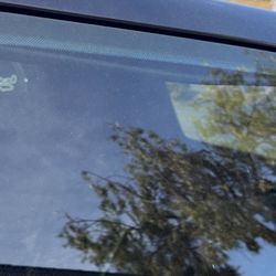 SIDCO Custom Upholstery - Condition after October 2024 redo attempt. Driver side rear window. This is on both sides. Bowed all the way across the liner.