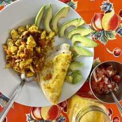 Waicura - Seasoned scrambled tofu with avocado, tortillas, and homemade salsas with fresh to order red juice