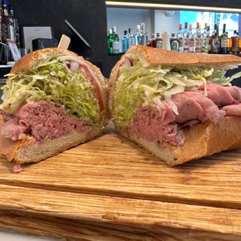 Capo Deli Tysons - Roast Beef with lettuce, tomato cheese and Italian dressing. Symphony in your mouth. - Delis Near Me - Vienna, Virginia Capo Deli Tysons - Roast Beef with lettuce, tomato cheese and Italian dressing. Symphony in your mouth. - Delis Near Me - Vienna, Virginia