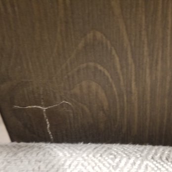 Ashley Store - CRACKED WOOD ON MID CHAIR BACK - Furniture Stores Near Me - Austin, Texas