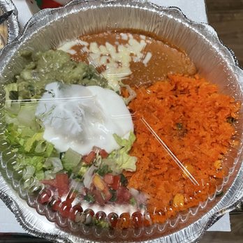 Fiesta Cancún Mexican Restaurant - To go dinner. Chicken  Chimichanga with rice, beans,pico, guacamole, and sour cream. - Mexican Near Me - Altamonte Springs, Florida