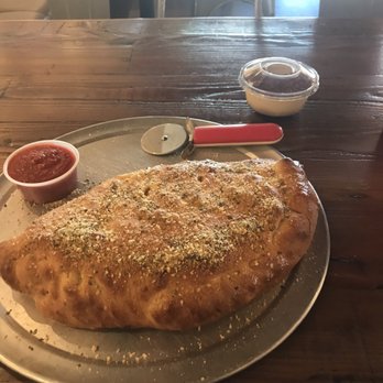 Bear Canyon Pizza - Pepperoni Calzone and Tiramisu in the background! - Pizza Near Me - Tucson, Arizona Bear Canyon Pizza - Pepperoni Calzone and Tiramisu in the background! - Pizza Near Me - Tucson, Arizona