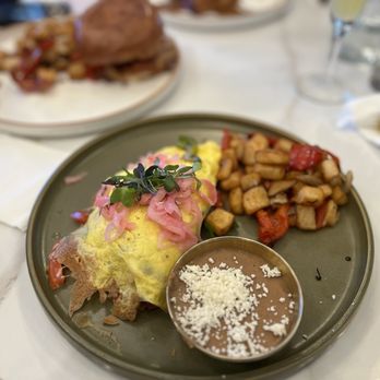 Camellia’s Brunch - Sunset Omelette, house potatoes and refried beans with cotija cheese on top - Breakfast & Brunch Near Me - Bonita, California