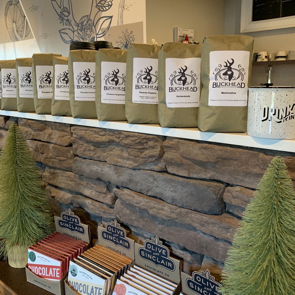 a display of coffee bags and christmas trees