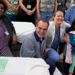 Kickstart Orthotics and Prosthetics - Uncle Tony LaFrance celebrating one of the superhero kids he helps!