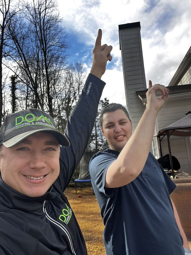 Slide of DOM Roofing & Restoration