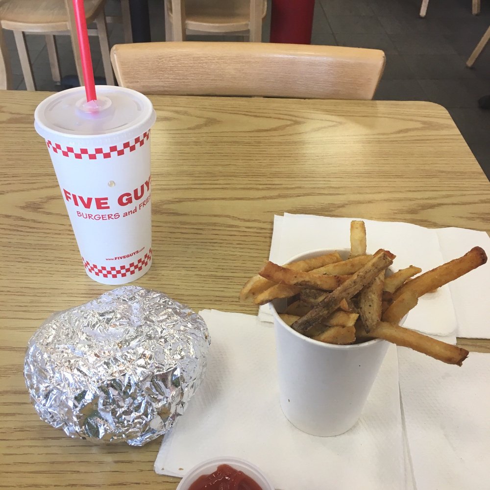Five Guys - fries and ketchup on a table - Burgers Near Me - Duluth, Minnesota Five Guys - fries and ketchup on a table - Burgers Near Me - Duluth, Minnesota