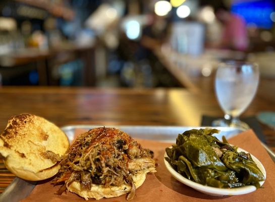 Photo of Frontier by Alamo - Richmond, VA, US. a pulled pork sandwich with a side of greens