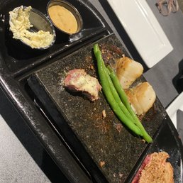 I ordered the ribeye and added on scallops and green beans as my side. The butter and rock sauce is the bomb.com!!