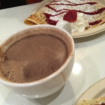 Crepe Crazy - Nutella Hot Chocolate with Sweet Berry in the background! (Mess on the cup thanks to me.. lol) - Creperies Near Me - Austin, Texas Crepe Crazy - Nutella Hot Chocolate with Sweet Berry in the background! (Mess on the cup thanks to me.. lol) - Creperies Near Me - Austin, Texas