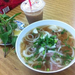 Kim Son Restaurant - Special beef noodles soup , fresh basil and bean sprouts and lemon as garnish. Iced white coffee:-)