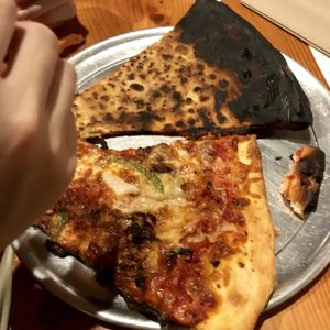 Photo of Sizzle Pie - Seattle, WA, United States. This is not even food at this point. I should have taken a photo of the bottoms too which also was extremely burnt.