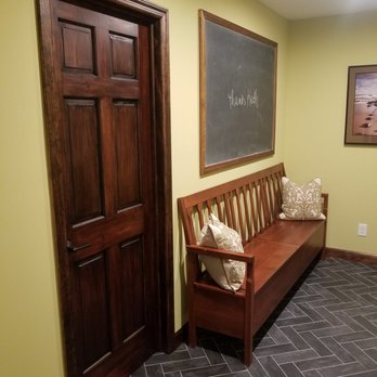 North Jersey Pro Builders - a hallway with a bench and a chalkboard - General Contractors Near Me - Glen Rock, New Jersey
