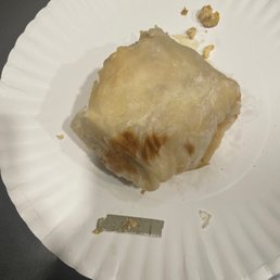 a piece of food on a paper plate a piece of food on a paper plate