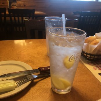 Texas Roadhouse - A tall, chilled glass full of ice water with lemons. - Steakhouses Near Me - Milford, Ohio