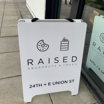 Raised Doughnuts and Cakes - At the entrance - Donuts Near Me - Seattle, Washington Raised Doughnuts and Cakes - At the entrance - Donuts Near Me - Seattle, Washington