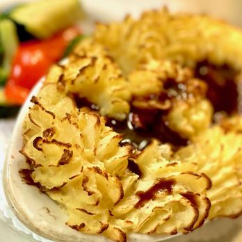 The Dam Pub - a plate of food with a side salad - Gastropubs Near Me - Meaford, Ontario The Dam Pub - a plate of food with a side salad - Gastropubs Near Me - Meaford, Ontario